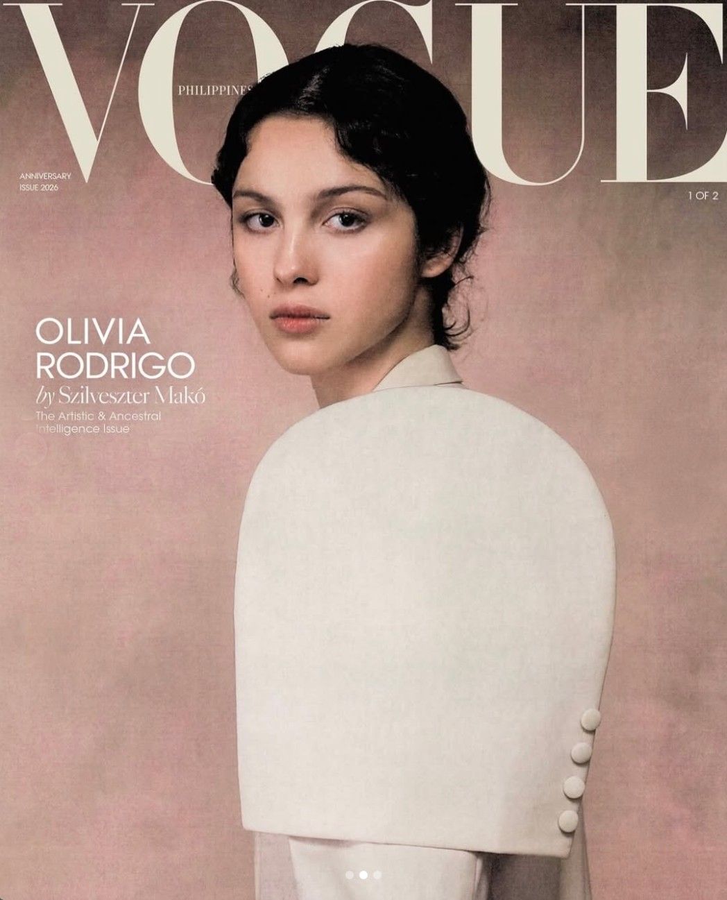 Magazine cover for Vogue Philippines featuring a portrait photograph of a person in a cream-colored draped garment against a dusty mauve background.