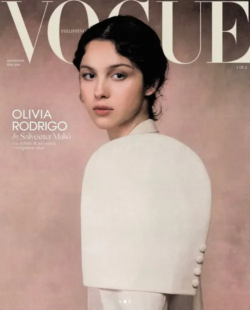 Magazine cover for Vogue Philippines featuring a portrait photograph of a person in a cream-colored draped garment against a dusty mauve background.